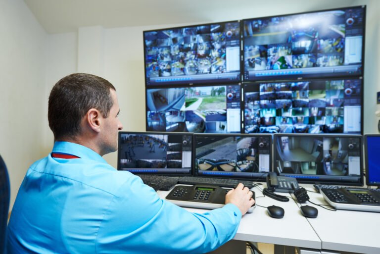 security guard watching video monitoring surveillance security system